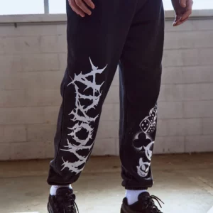 MORTA GRAFFITTI PRINT TRACK PANTS IN WASHED BLACK