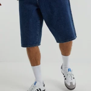 Y2K BAGGY DENIM JORTS IN MID WASH